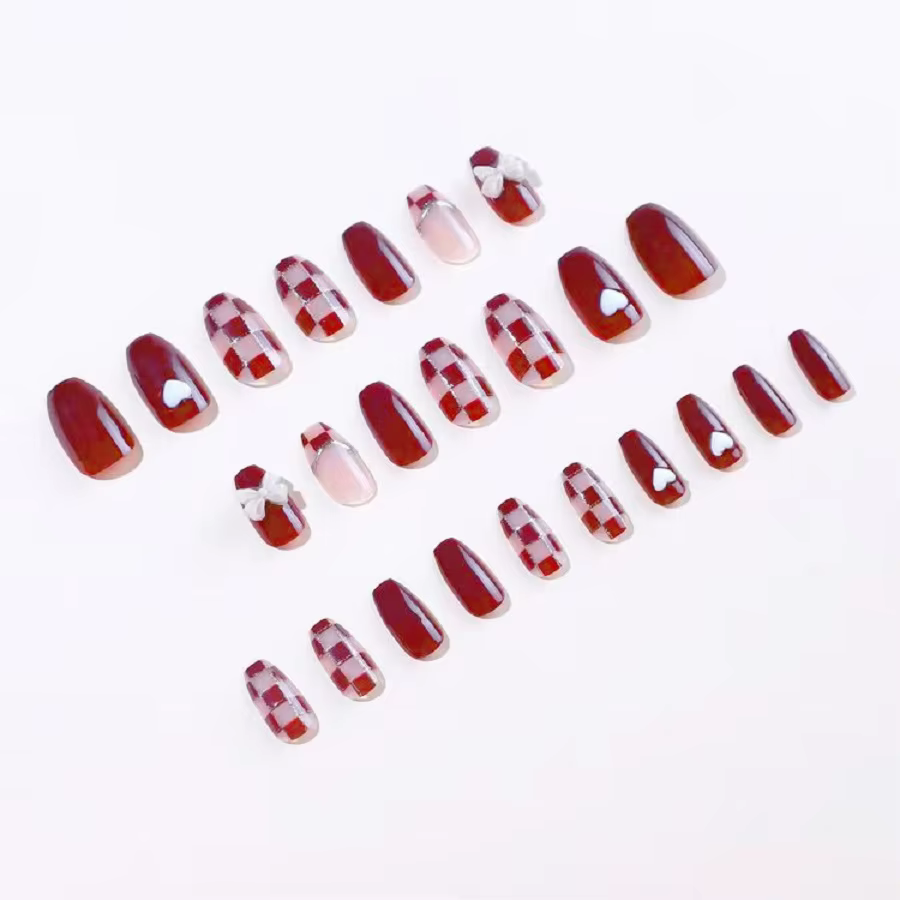 24 pièces/1 boîte faux ongles en damier en poudre d'or avec nœud rouge