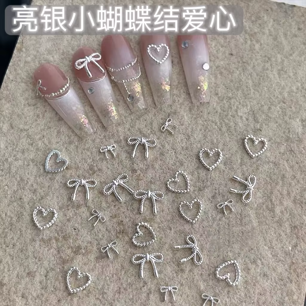Décorations d'ongles avec nœud papillon en argent