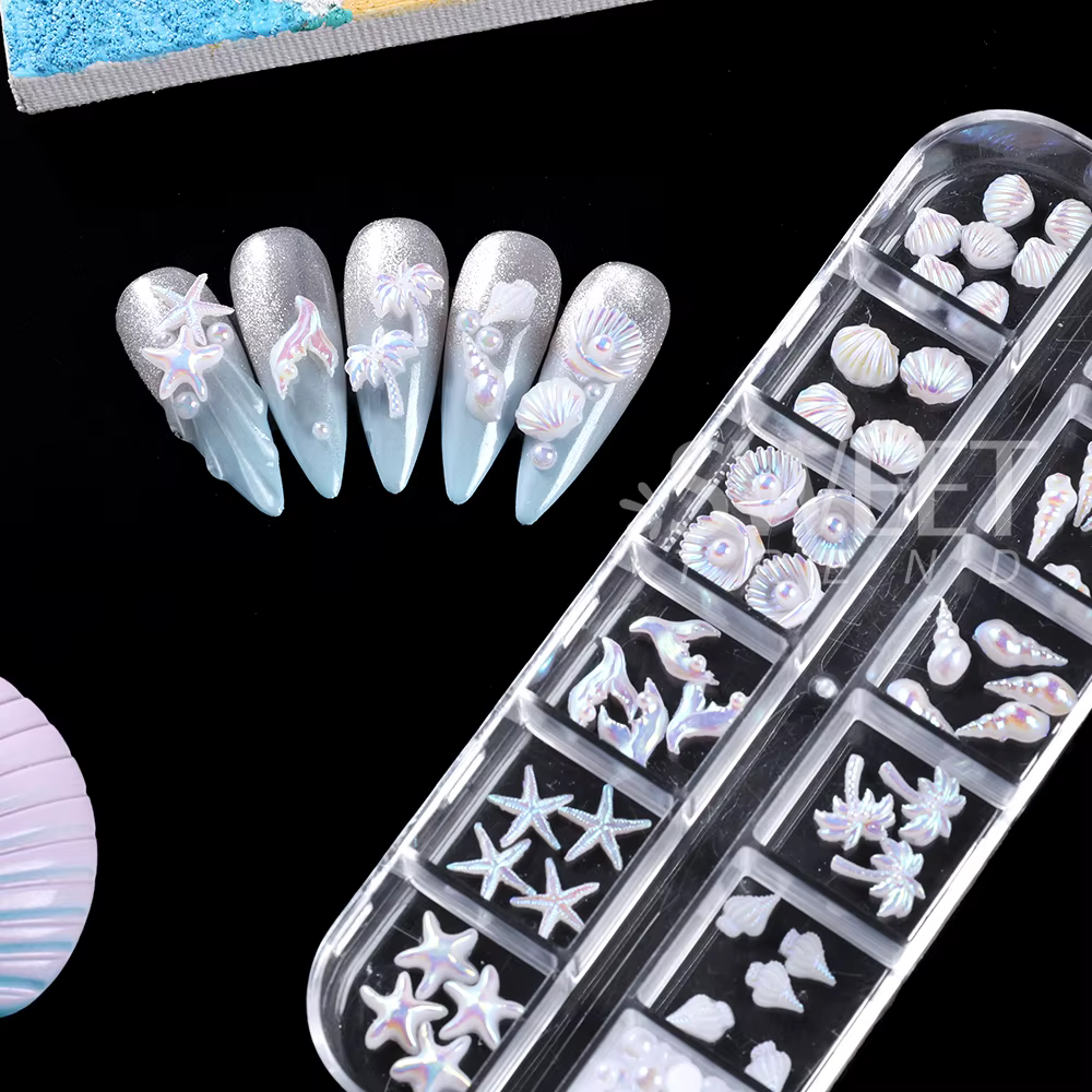 SWEET TREND - 12 compartiments de breloques 3D pour nail art sur le thème de l'océan : coquillages Aurora