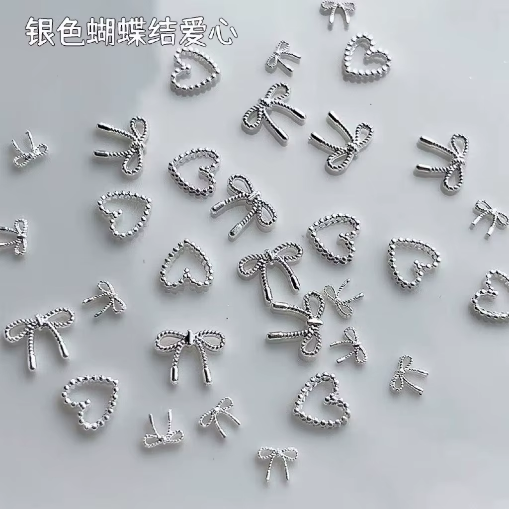 Décorations d'ongles avec nœud papillon en argent