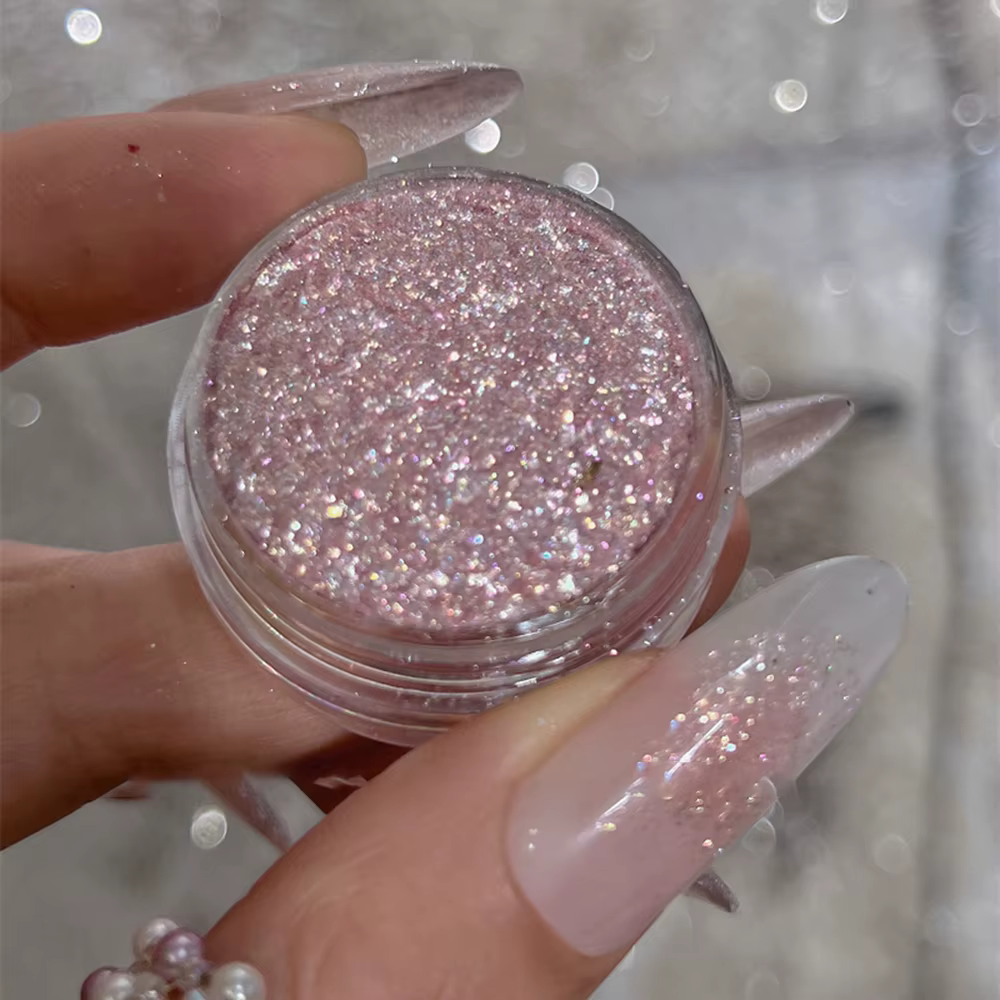 Poudre à paillettes rose scintillante pour ongles