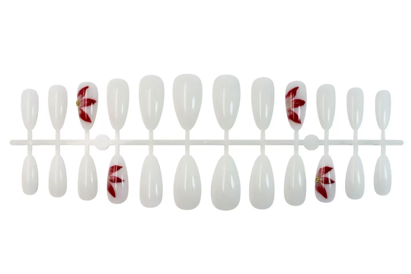24 faux ongles ovales blancs mats avec décorations de fleurs de lys rouges peintes à la main