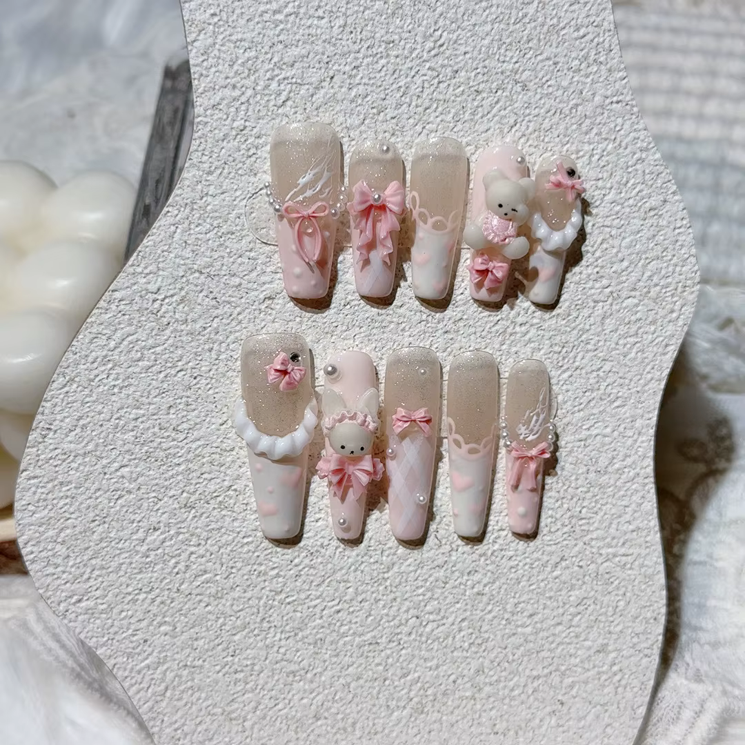 Faux ongles avec nœud rose