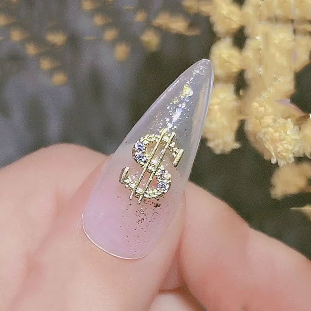 Décoration d'ongles en forme de dollar en argent et or