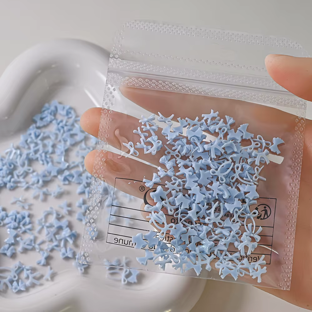 100 pièces 3D bébé bleu mixte nœud papillon Nail Art décorations résine doux ruban arcs ongles breloques pour bricolage artisanat manucure accessoires