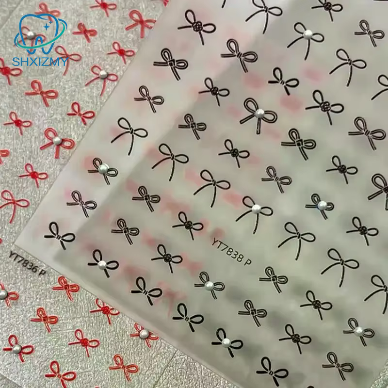 Autocollants pour ongles exquis en forme de mini-nœuds